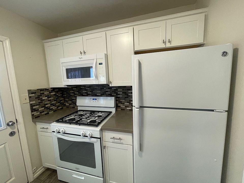 Fridge, Stove/Oven and Microwave 
Door to private patio on side yard