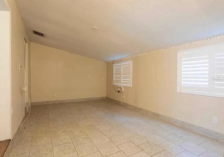 Master Bedroom and laundry with access to backdoor / patio