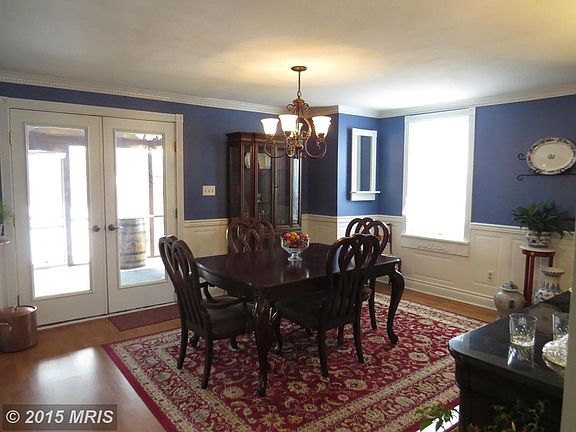 Rich hardwood floors, french doors, chair molding