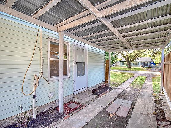 From this view of the driveway, you can see there is a side entry to the home.