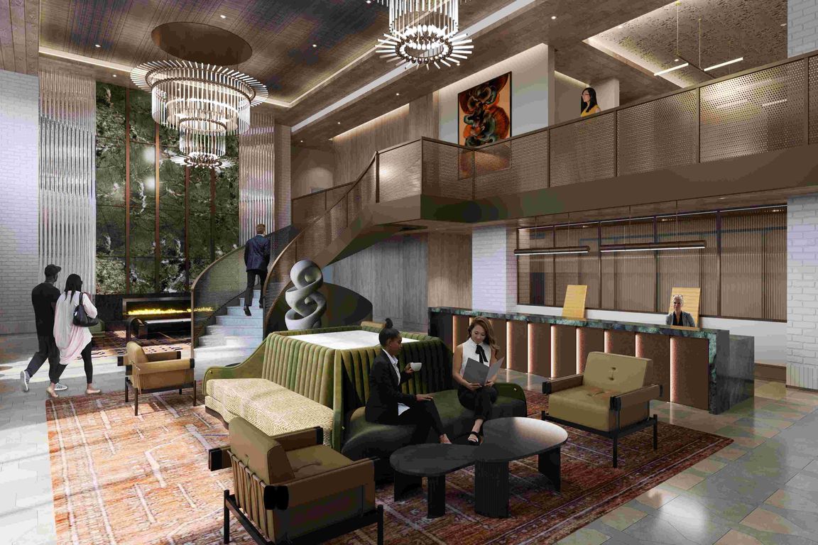 A welcoming lobby defined by soaring ceilings, curated art, and attentive service.
