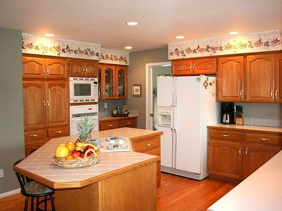 Open Kitchen with spacious island and cabinets galore