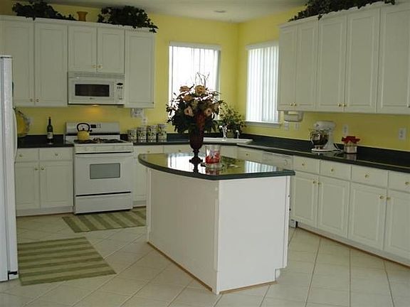 Gourmet Kitchen with corian countertops 