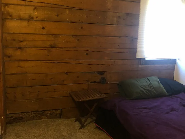 Two bedrooms with the character that a log building brings