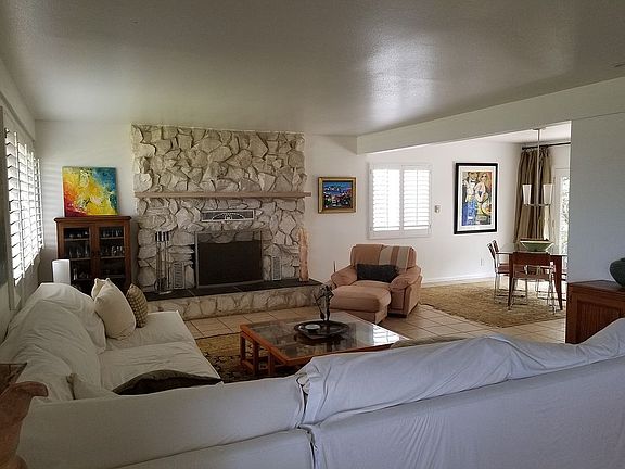 Living room w/rock fireplace
