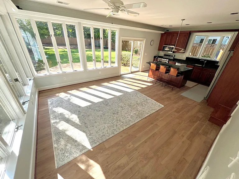 Family Room and Kitchen. Three bar stools will remain for your use.