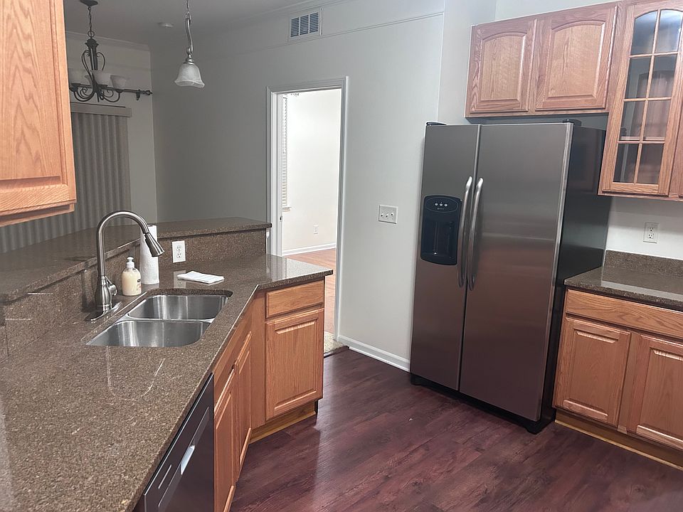 Kitchen with access from Garage and laundry room, living room and main entry