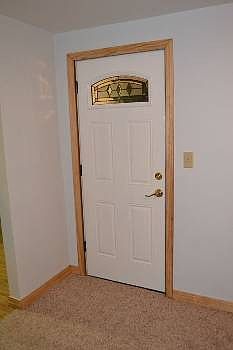 The front entrance comes in off of the new sidewalk that goes to either the breezeway or the front porch.  The home features new exterior doors.