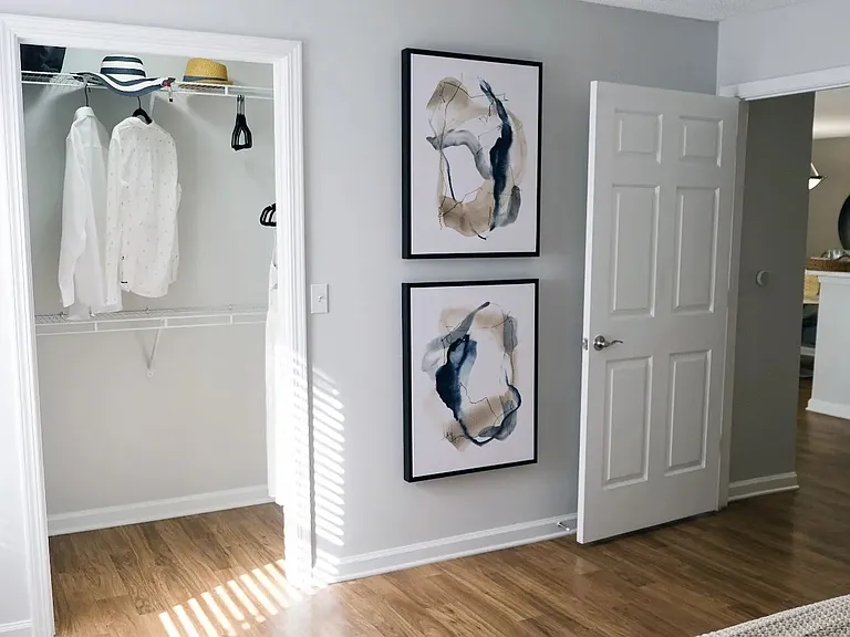 Ample space and thoughtful organization await in your primary bedroom, featuring a walk-in closet.