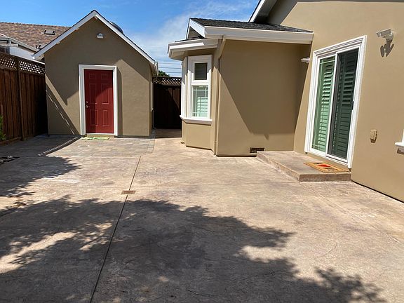 Large patio and storage/ hobby room