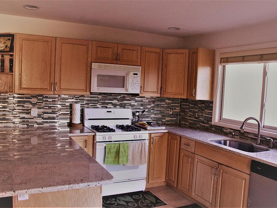 Granite counter top with glass tiled backsplash, extra-wide/