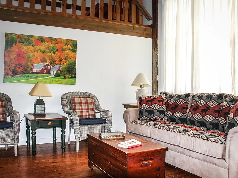 Sitting room in loft is see above the open living room.