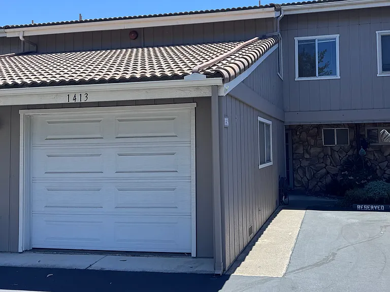 Attached one car garage and one reserved parking next to front door.
