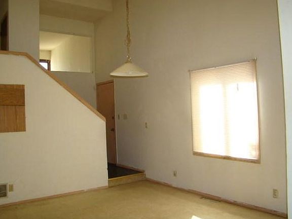 Main floor with side door entry. Stairway leads up to 2nd floor
