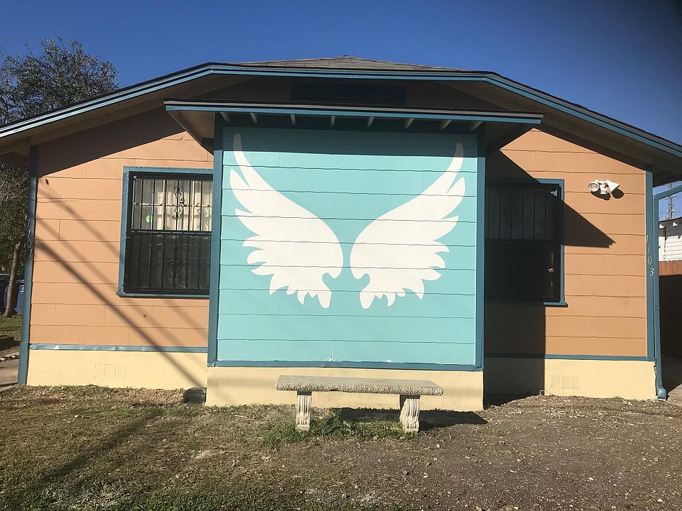 Front of house painted by local painter for social media photo ops.