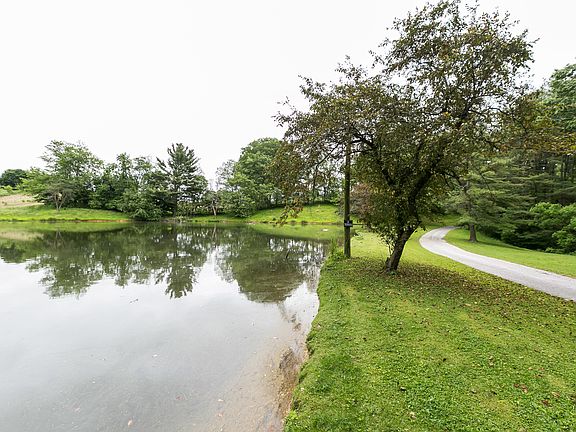 Private drive next to pond