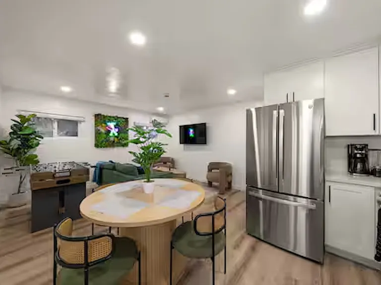 Dining area with a four to six-person table (expandable) in the open-plan living space_perfect for meals, snacks, or hanging out with friends and family. A chill spot for game nights, homework, or just catching up together.