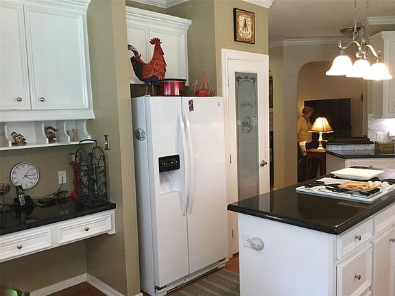 Kitchen is light and bright, specialized Pantry door is gorgeous