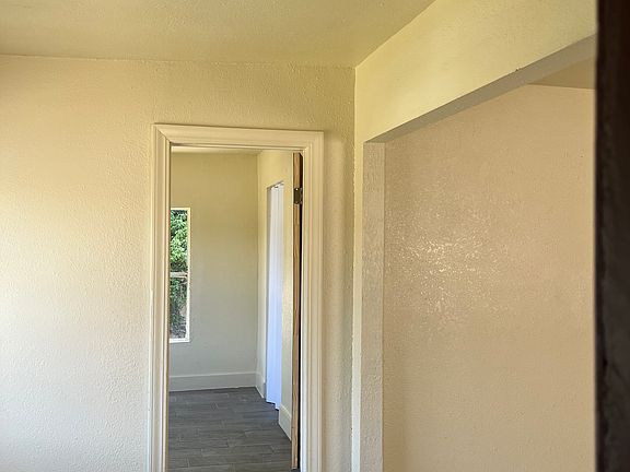 Front entrance to the open concept living room and dining room area