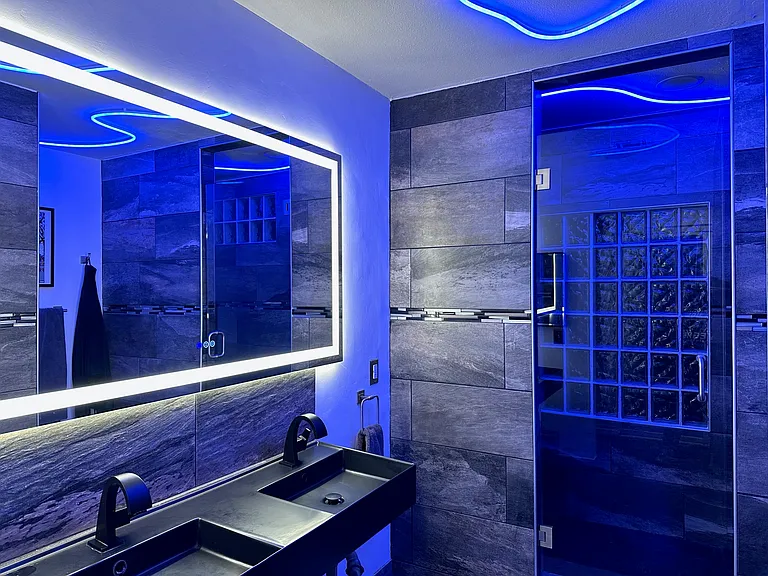 Master Bathroom with two person shower, bidet, roof speakers, LED lighting, and heated mirror.