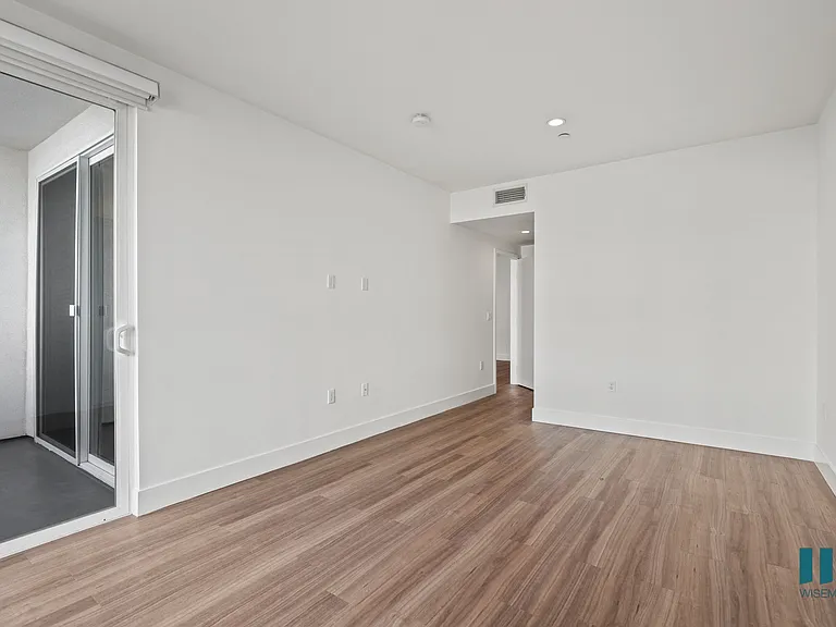 Bedroom with REecessed Lighting, Vinyl Flooring, and Patio