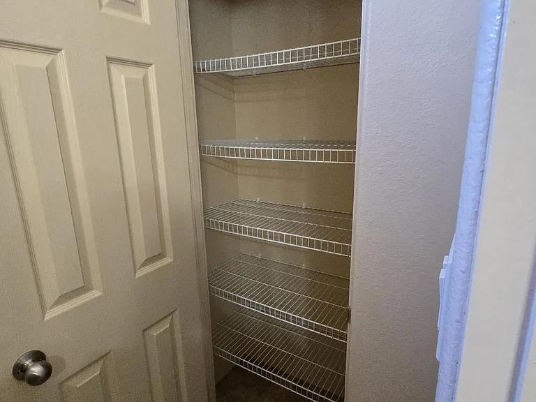 Storage closet in second floor guest bathroom