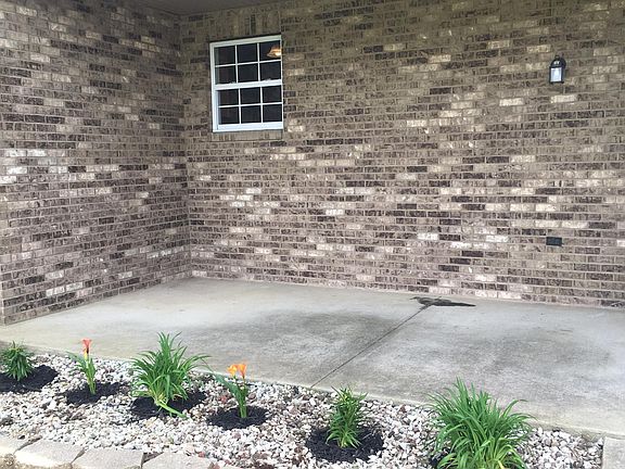 Covered front porch ready for you to sit and relax.