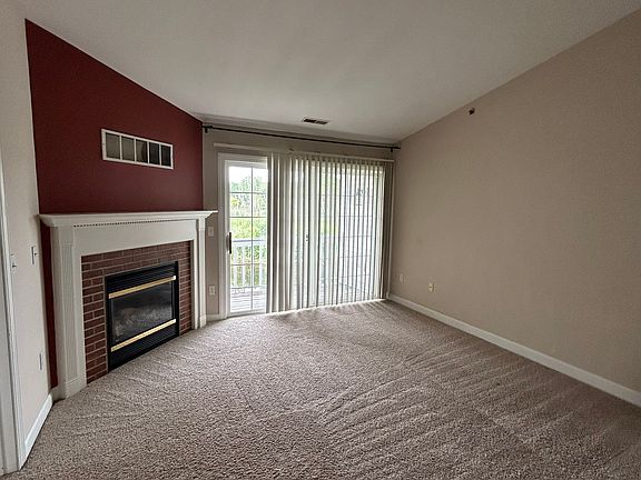 Family room with gas fireplace, walks out to balcony