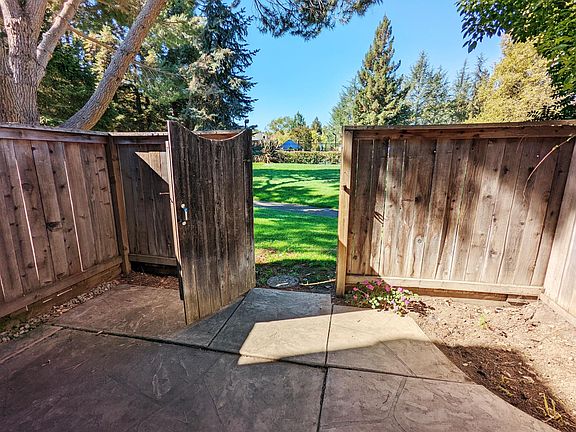 Back patio with door leading to central park and pool area
