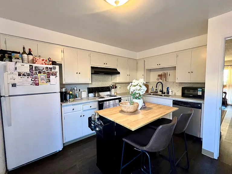 Furnished neighboring unit shown for kitchen layout reference