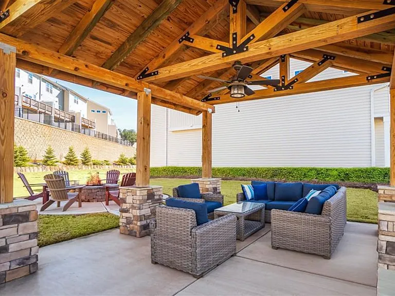 Community pavilion with outdoor lounge seating and fire pit