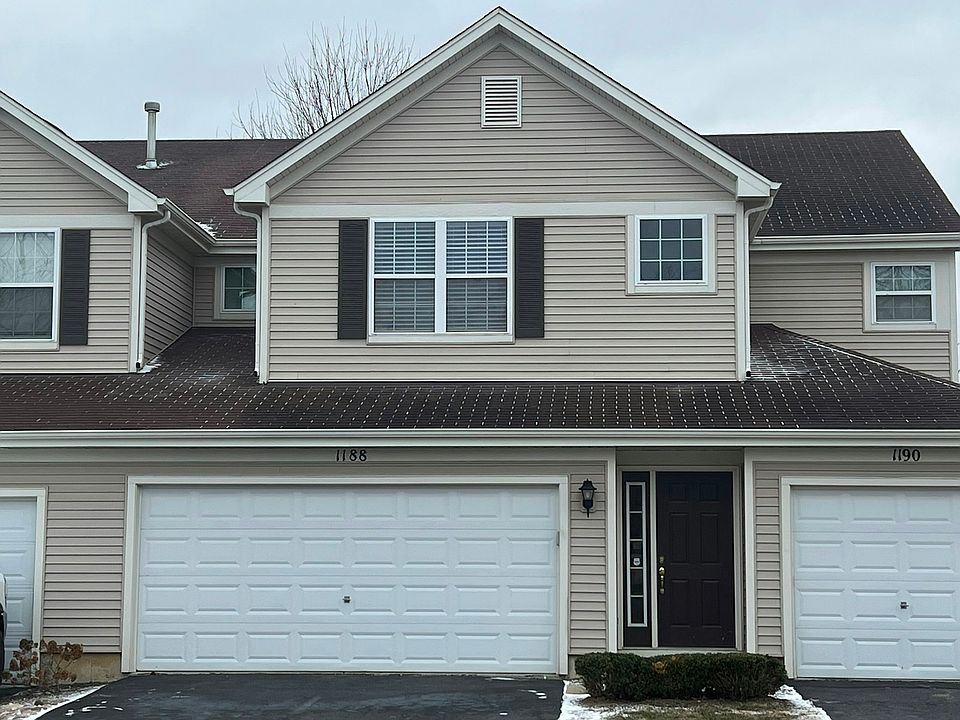 Outdoor view of Unit (2 car garage belongs to this unit, entry door to the right).