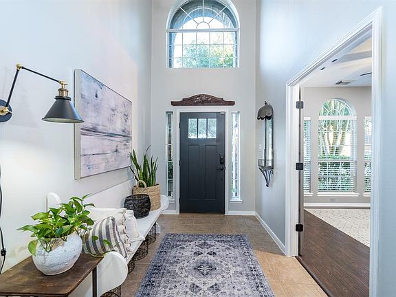 Tons of natural light greets you home along with a recent pendant fixture that was hard to capture due to the ceiling's soaring height.