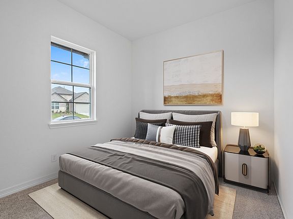 Your secondary bedroom features plush carpet, fresh paint, closet, and a large window that lets in p