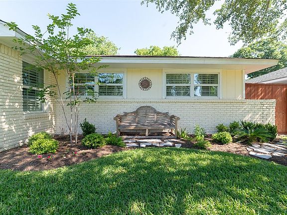 Lovely landscaping in front, Undereaves recessed lights and exterior security lighting. Most windows are Double-paned windows. Attic insulation.