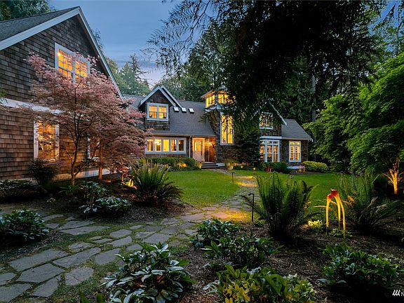 This stunning Cape Cod styled home is beautifully enhanced by the magic path lighting which surrounds the home!>