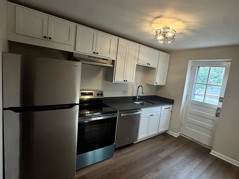 Newly renovated kitchen as of April 2026 featuring all brand new appliances and light fixture