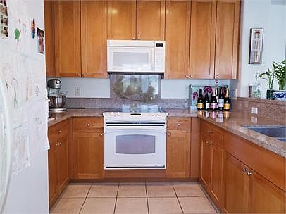 Beautiful kitchen with granite tops.
New stainless refrigerator not shown