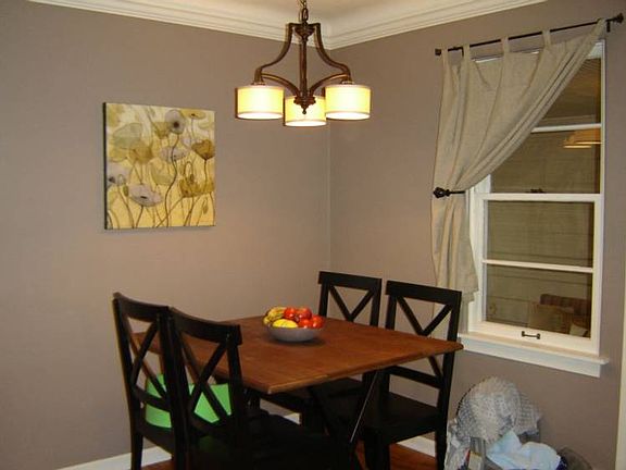 The informal and spacious dining area in the kitchen is convenient and cheerful and even has room for baby's highchair.