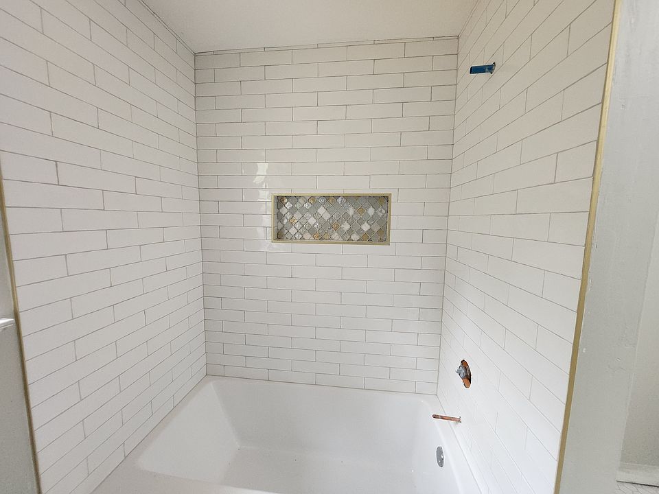 NEW CLASSY TUB AWAITING BRASS FIXTURES, LAUNDRY HOOKUPS