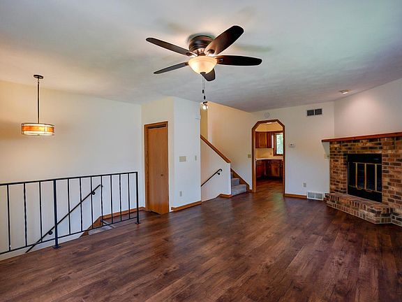 Luxury laminate flooring. Wood burning fireplace