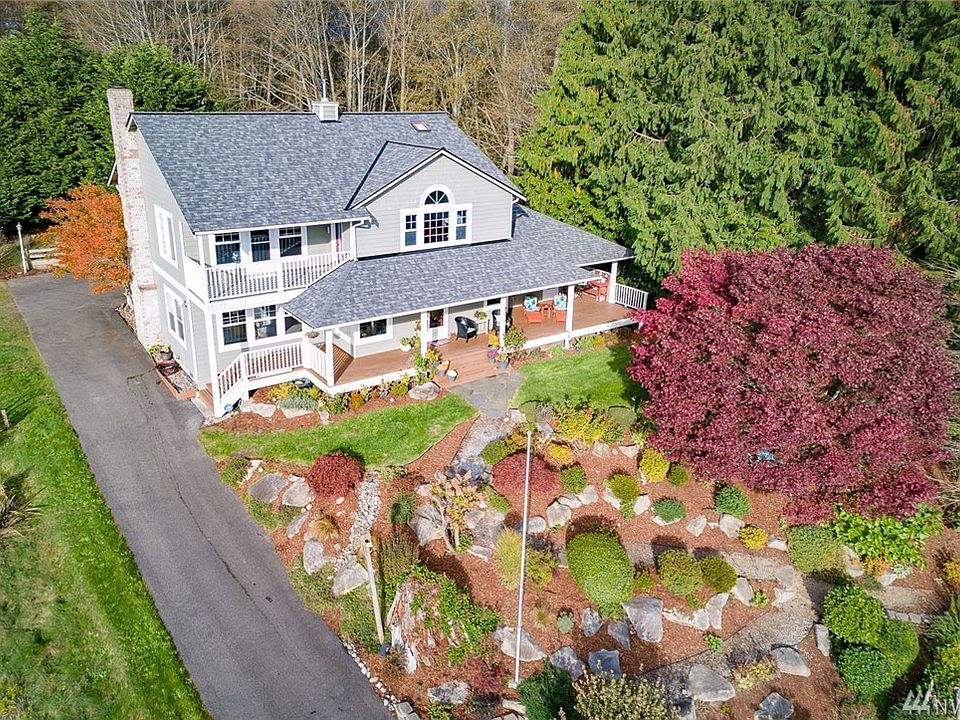 What a beautiful home with perfectly manicured but low maintenance landscaping.