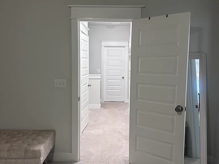 master bedroom facing hallway to 2nd bedroom