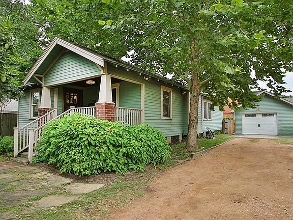 This bungalow has a garage and an extra parking space.