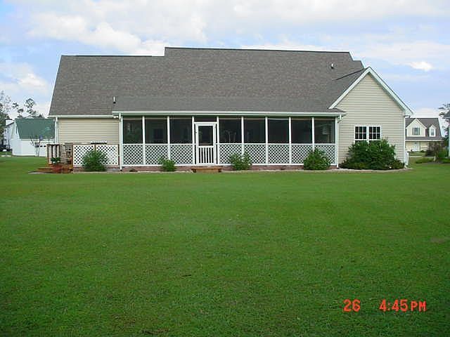Back of house with covered patio