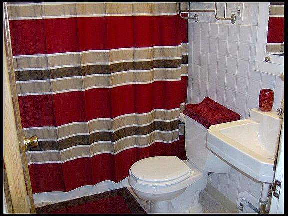 Squeeky clean bathroom with new vinyl flooring and fresh paint