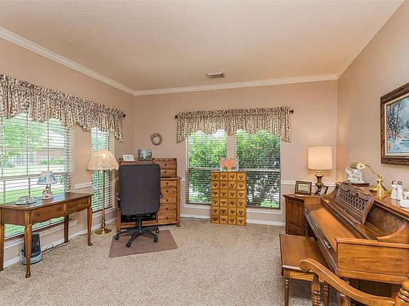 On the other side of the entry, you have this extra living space which could be used as a home office, a music room or a formal living room.