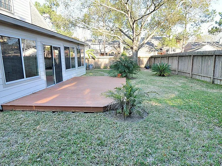 The deck behind the patio.