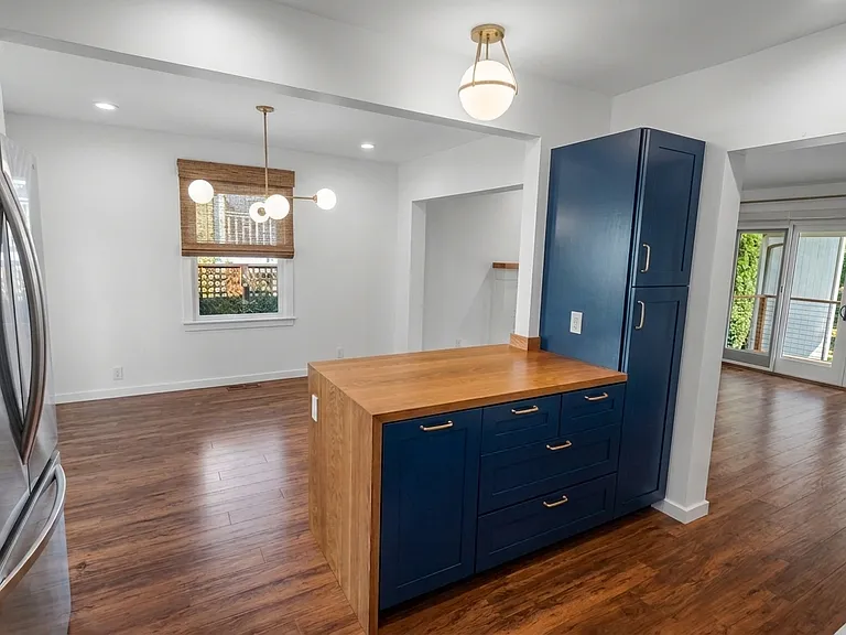 Open floor plan view of dining room and living room from the kitchen