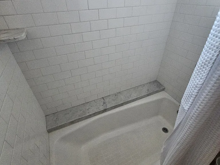 Guest bathroom remodeled. Tub pulled out gives more room with the tile